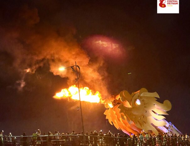 Iconic Dragon Bridge in Da Nang releasing a burst of fire during the evening show.