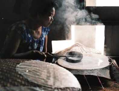 Local artisan demonstrating traditional rice paper making in Hoi An.